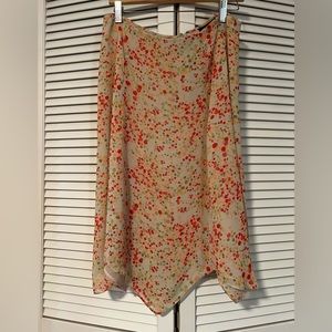 Apostrophe sheer overlay high low print skirt lined zig zag hem. size12